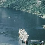Coastal cruise ship docked in a Norwegian fjord